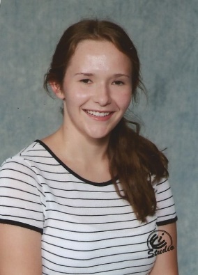 A person in a white shirt Description automatically generated